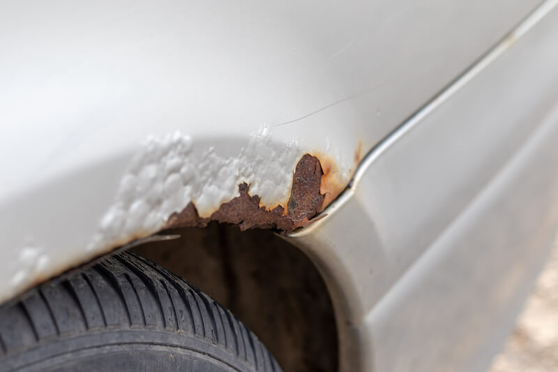 Rust forming on car undercarriage due to climate change & extreme weather.
