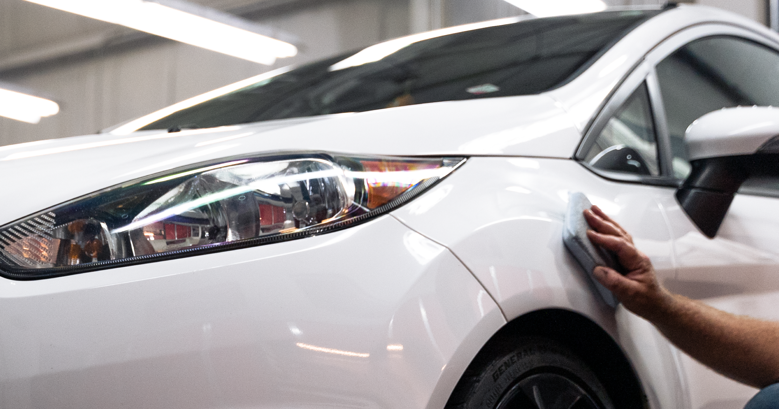 Close-up of rust damage on car undercarriage caused by winter road salt exposure and corrosion