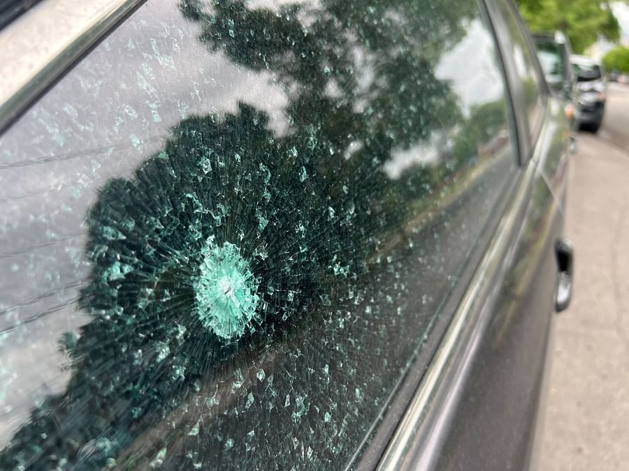 Close-up view of hail damage on a car\'s surface