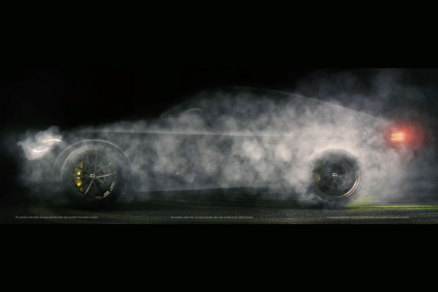 Broken down Nissan car with smoke coming out of the engine