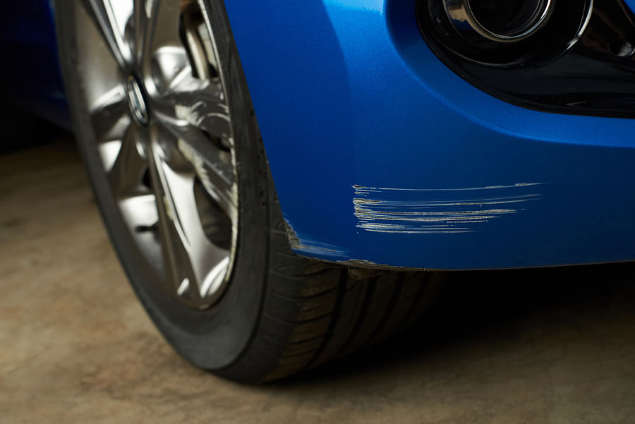 Close-up view of deep scratches on car\'s surface
