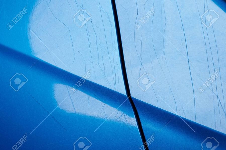 Close-up view of glossy car paint reflecting light